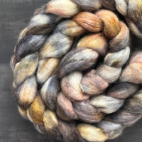 70% untreated BFL, 30% bright trilobal nylon inspired by Precious Rock colourway